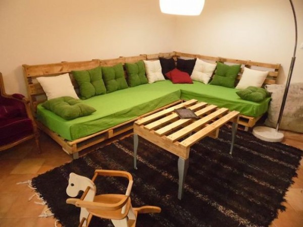 corner sofa with a table made with pallet